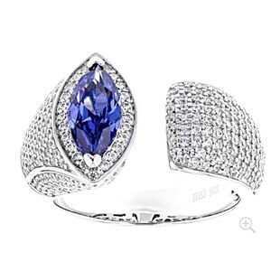Size 7 Tanzanite and diamond look ring . Unique design Rhodium plated silver.